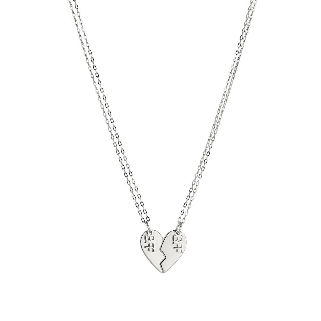 Product image of a pair of sterling silver best friend necklaces that when put together, make the shape of a heart. Each side of the heart has a charm attached with the word 'BFF'.