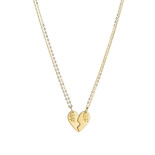 Product image of a pair of sterling silver best friend necklaces, with 14k gold plating, that when put together, make the shape of a heart. Each side of the heart has a charm attached with the word 'BFF'.